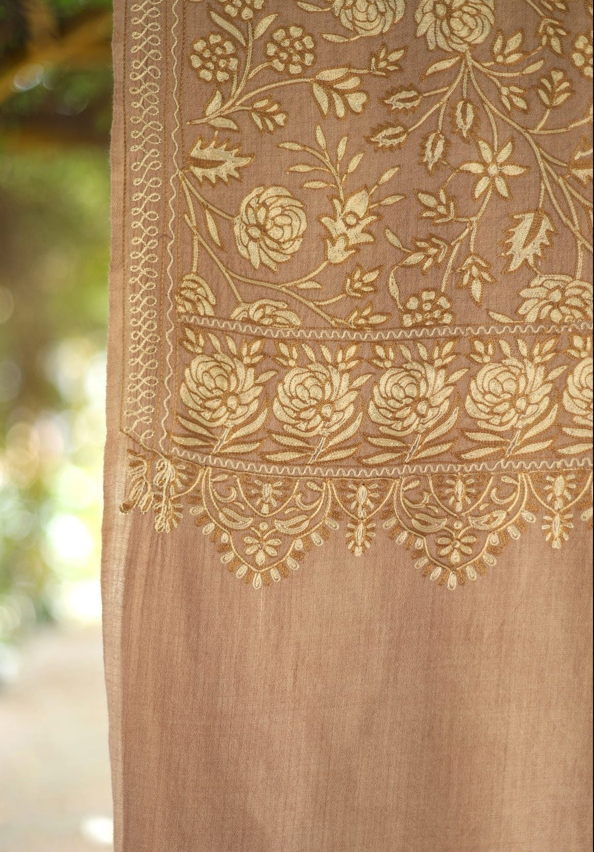 Brown fabric with gold floral embroidery
